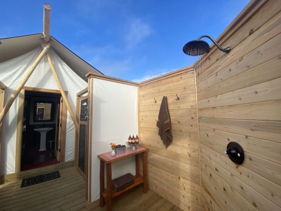 Canvas and cedar-clad patio on the master en-suite tent