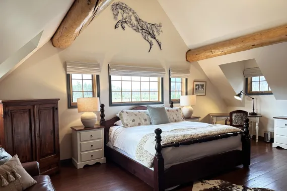 An authentic ranch accommodation at this luxury lodge with king bed and country furnishings