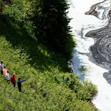 Waterfalls cascade into a crater lake